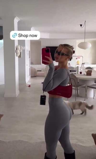 showing off in grey sweatpants