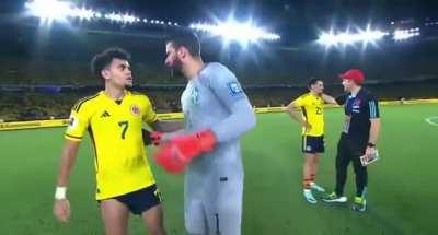 Ali and Luis embrace at the end of the game