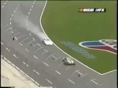 Racecar is hit by it's own wheel that came loose during racing