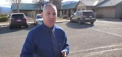 Cop gets flustered and embarrassed by silly questions.