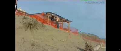 Man does somersault off hill and destroys is balls on the roots of an old tree!