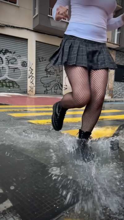 Running through a puddle in the rain