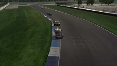 Im racing the Green Ferrari into the final chicane at Indianapolis and I feel I may have cut across him under braking or is it his fault? (Im the white and black BMW)