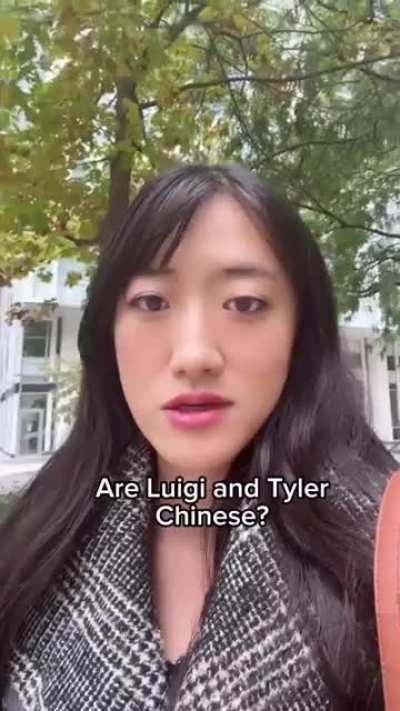 An Asian woman reacts to people calling her a Chinese spy