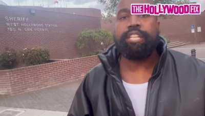 Video of Ye getting into an argument with a paparazzi while going to the police station Tuesday.