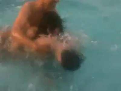 Employees having fun at office pool party