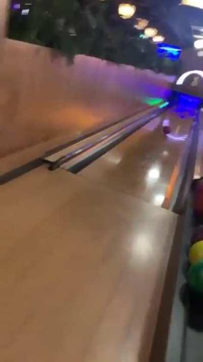 Bowling ball returns to the girl after a bad throw
