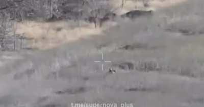 footage showing a russian soldier trying to shoot down a Ukrainian drone but still gets hit with its drone drop munition. {music from source}