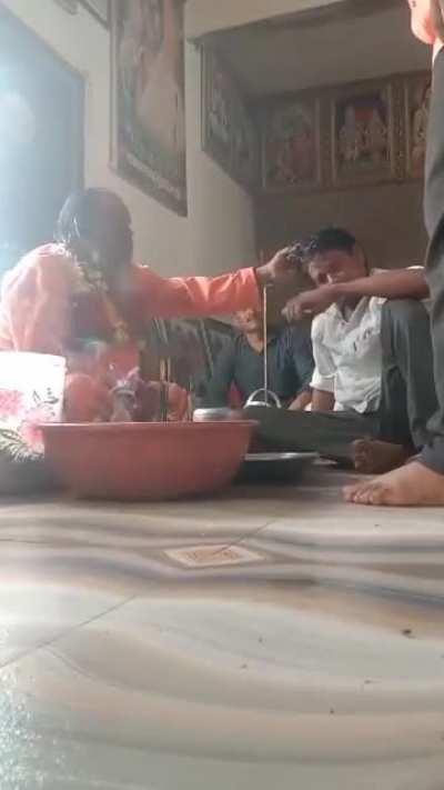 Spiritual healer cleansing bad spirits from a helpless guy