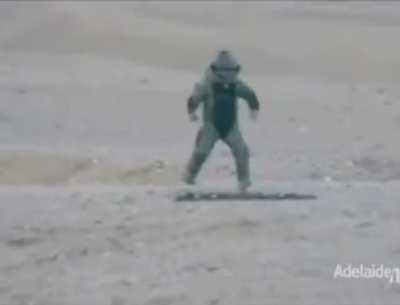 Guy dancing in an EOD suit after defusing training bomb