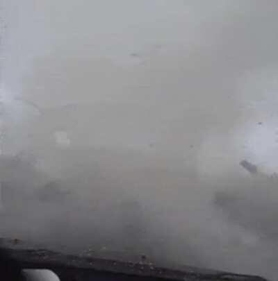 Driving next to a moving tornado