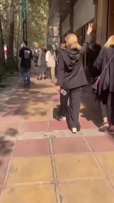 Iranian women are defiantly walking on the streets of Tehran, with no hijab…while cars are honking in their supports