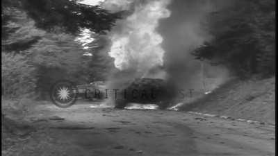 Two M4 Shermans are burning after being hit by an anti-tank gun outside of Wegscheid Germany on May 4, 1945.