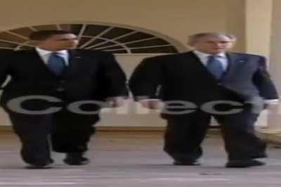 Wide Obama and Wide Bush walking