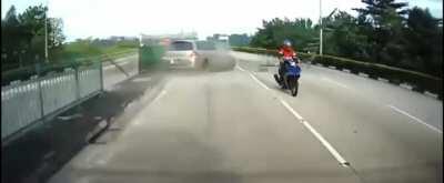 Biker is unfazed by flying guardrails