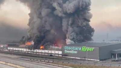Local mall burning down due to current unrest in Pietermaritzburg, South Africa