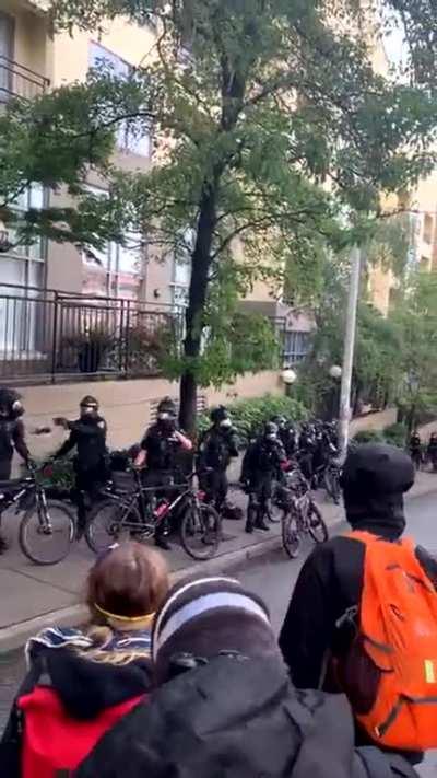 Police on bike drags a peaceful protester to the ground for no reason