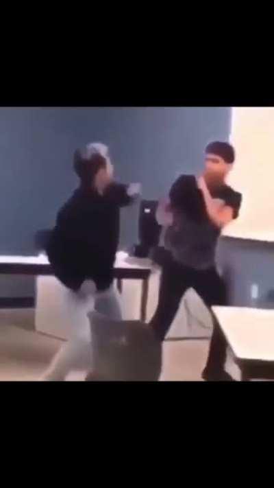 Kid gets rocked hard by a backhand punch