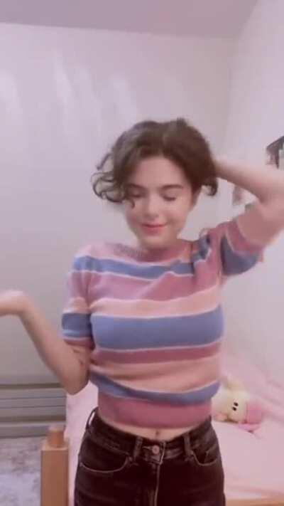 Becca adjusting her sweater