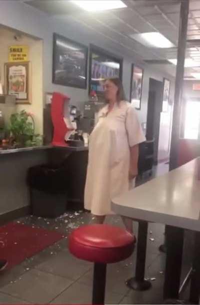 Crazy woman terrorizes people at a restaurant