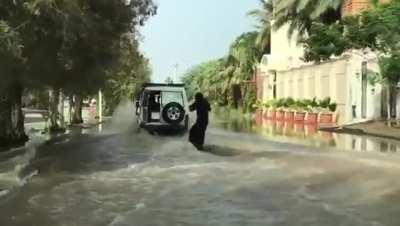 Saudi girl Car Surfing after heavy rains and flood in Saudi Arabia