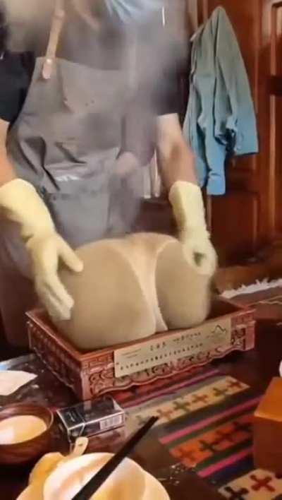 A Mongolian dish, Khorkog being cooked.