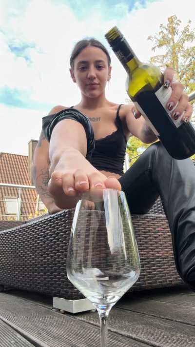 Care for a little wine… served from my feet?
