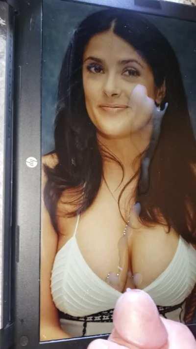 Covering her huge tits with a big load