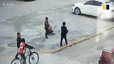 Boy throws Firecracker Into Manhole, causes explosion and making him fly.