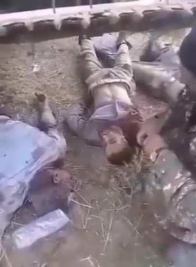 Armenian Warcrime: Armenian army proudly records itself mutilating Azerbaijani soldiers.