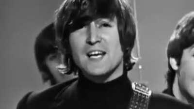 Ringo holding an umbrella.