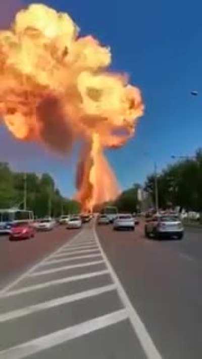 The dude in the silver car. 