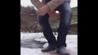 WCGW with squatting next to a hole in the ice