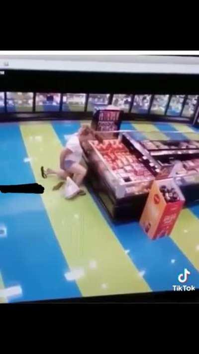 Woman taking a dump on the floor at Walmart(?)