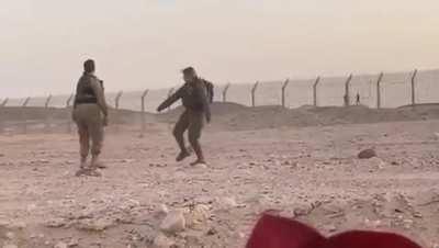 Israeli soldiers dancing with Egyptian soldiers on the other side of the border