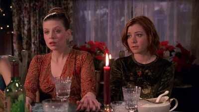 Christmas dinner at Buffy's house. Anya tells Dawn the truth about Santa Claus while Giles opens a 2nd bottle of wine