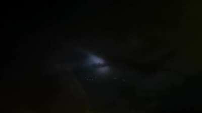 Pretty crazy sighting over Pacific on a red eye - its hard to believe what I am seeing. There are no buildings, ships, nothing on the ground.