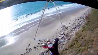 The harness fails to hold the hang glider