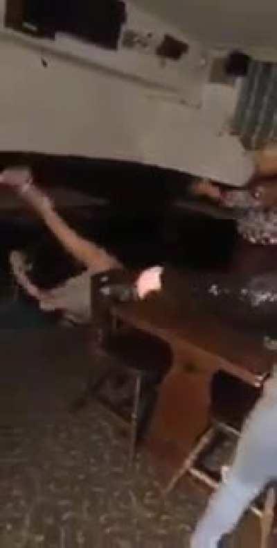 drunk girl does backflip on a table