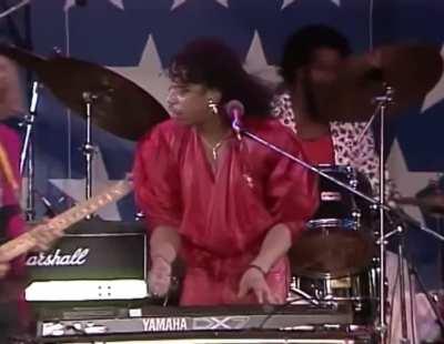 Rick James selects the wrong preset on his synthesizer during his performance at Farm Aid 1986