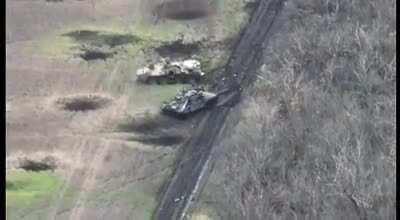 Russian tank hit by ATGM while crew is dismounting, causing one soldier to be flung through the air