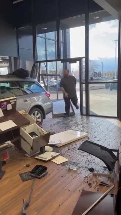 Man crashes car into dealership showroom due to overcharge 