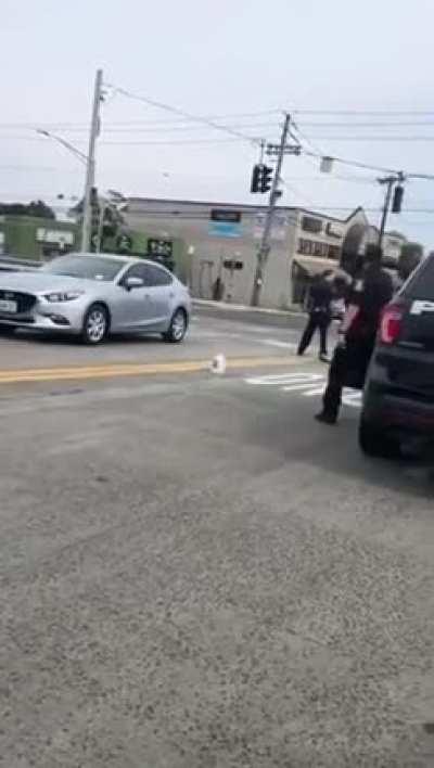 Nude black guy swinging his external organ of the reproductive system in public.