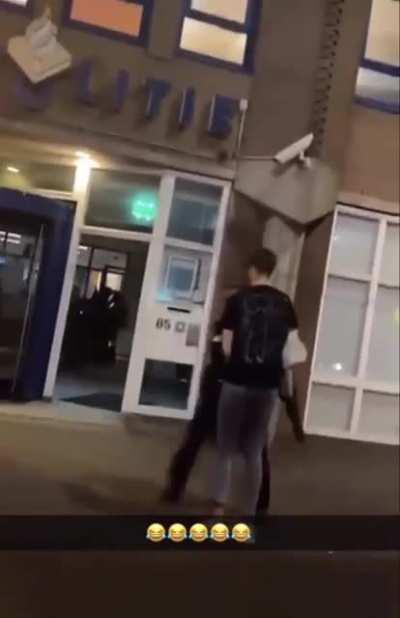 Publicly urinating in front of a police station