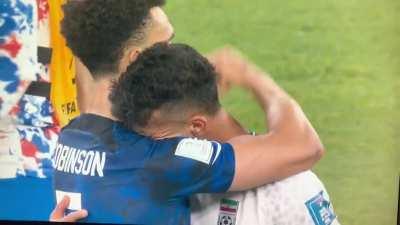 Irani and USA footballplayer give each other a hug after the game (1:0 USA)