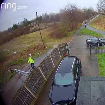 Man on a scooter vs. a steel gate.