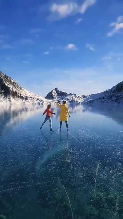Ice skating at frozen lake
