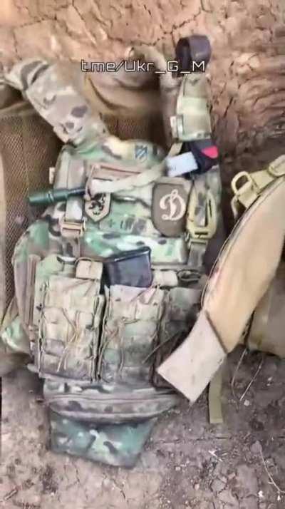 RU POV: Gear of fallen Ukrainian soldiers, seen Nazi insignias. Including patches of SS Galitzien, Azov insignias and 3rd Reich Eagle.