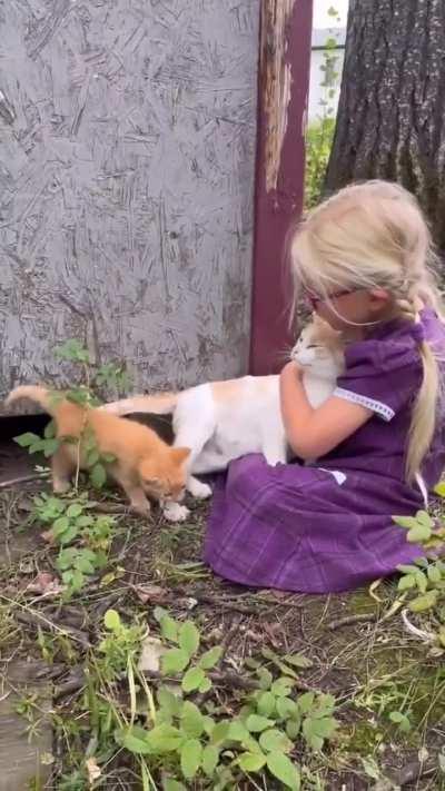 Mama cat introduces her kitten to her favorite human.