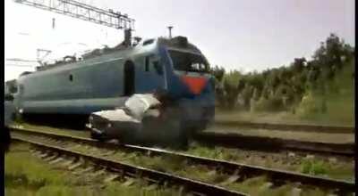 Car gets stuck on set of railway tracks (OP's - Several channels on YT)